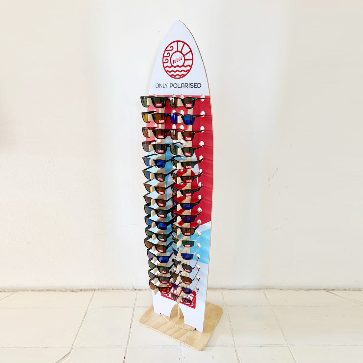 Tubes NIAS Polarised Sunglasses - on surfboard stand